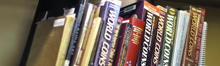 A row of books on world coins